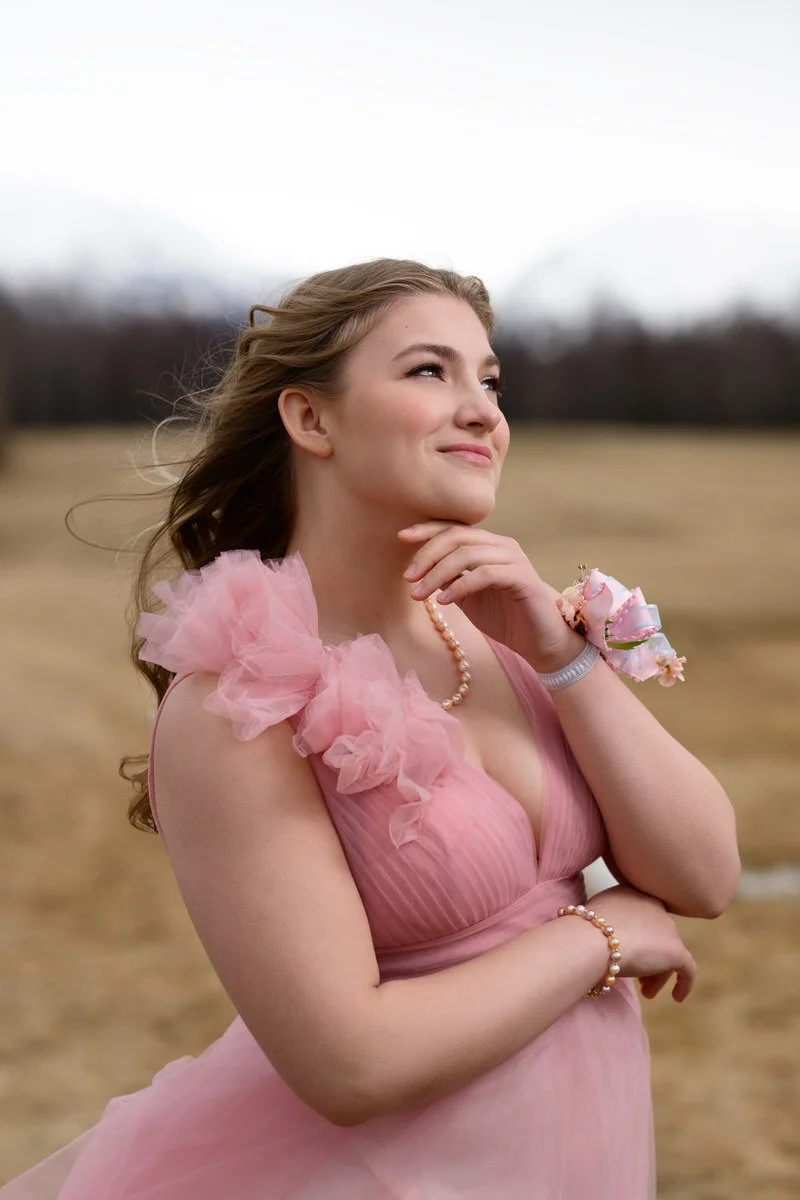 portrait of a girl in a pink gown with pink ruffles in alaska