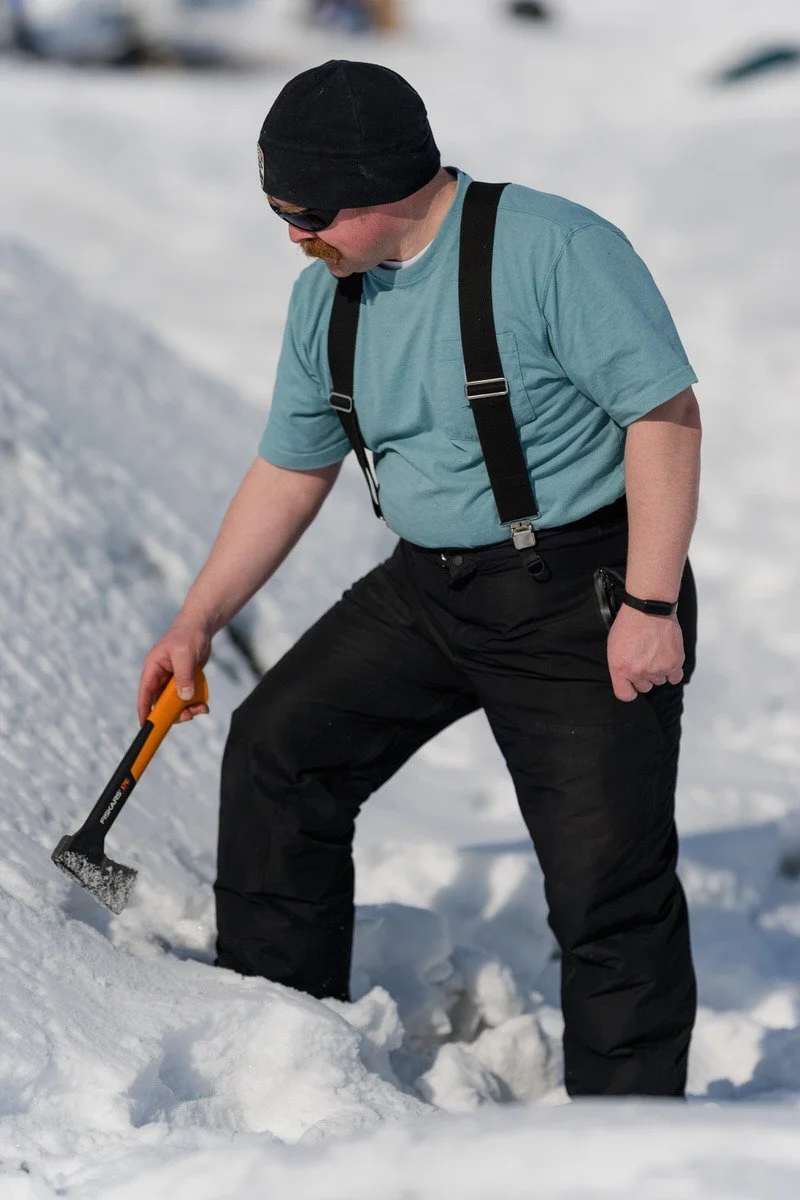 Man holding an ax on the Knik glacier