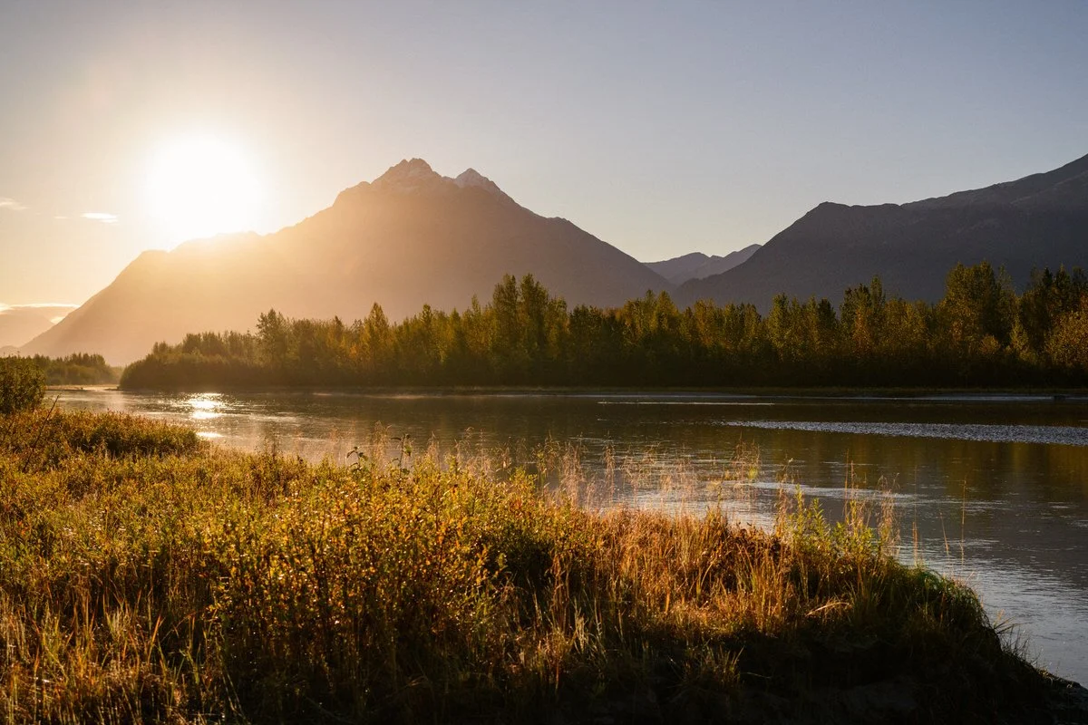 Image of the sun rising above Pioneer Peak in Palmer Alaska
