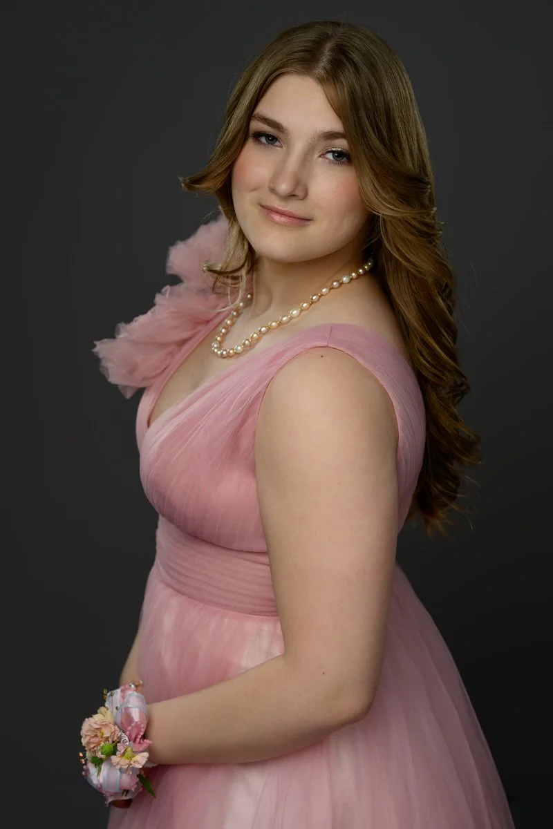 portrait of a girl wearing a pink prom dress with pearls in a studio in Palmer, Alaska