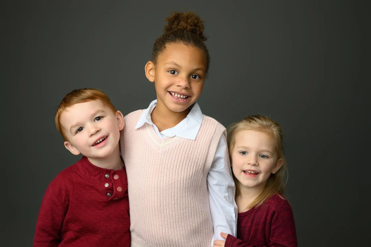 Siblings pose for a portrait