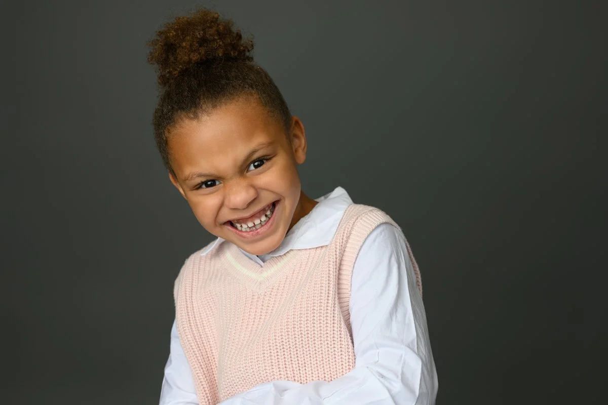 Little girl laughs in her photo