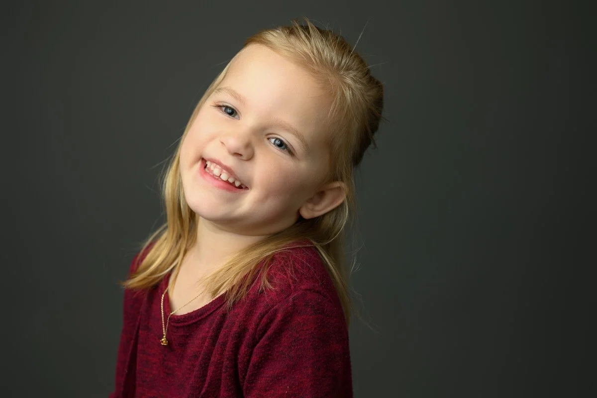 Little girl laughs in her portrait