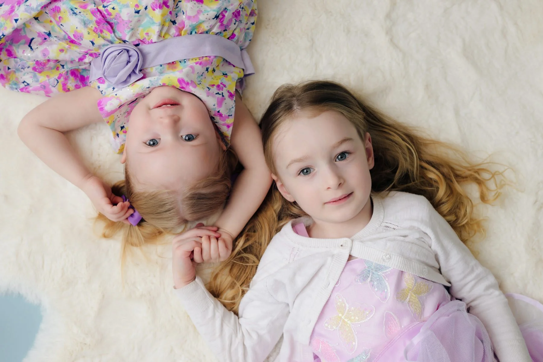 Sisters holding hands during Easter photoshoot in Palmer, Alaska