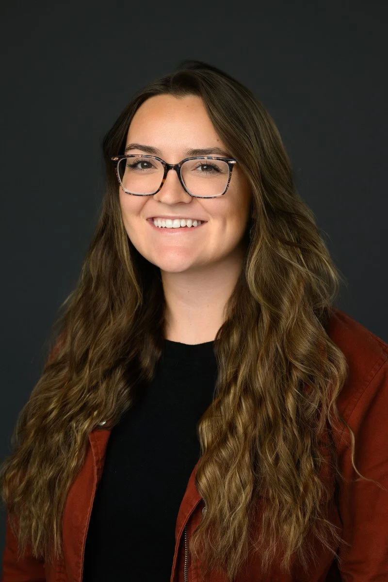 Headshot of a woman wearing a red shirt