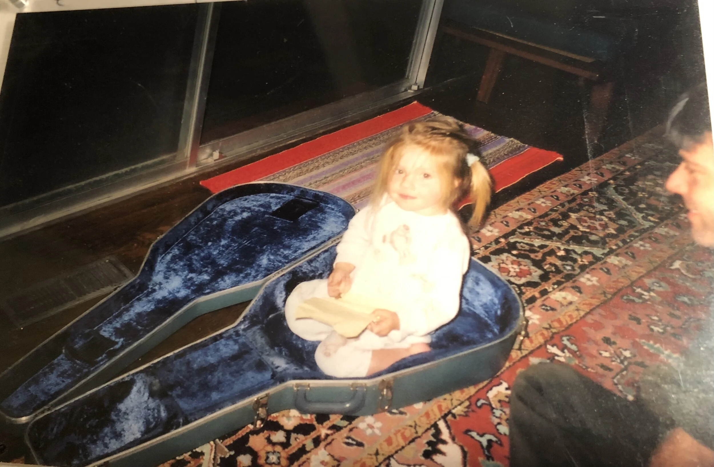 That’s baby me in the guitar case :)