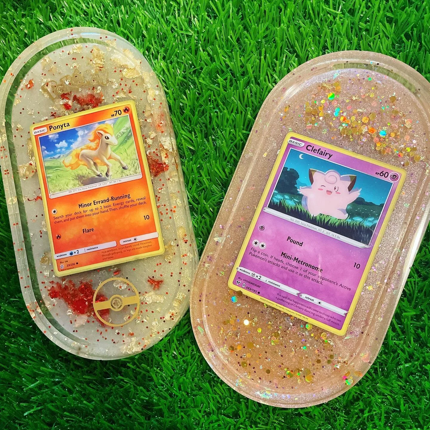 Check out our newest Oval Trays featuring Pok&eacute;mon cards! 🧡💖

.
.
.
.
.
#resin #resincraft #resinart #handmade #resinobsession #resinart_daily #vibrant #explore #explorepage #vibrantgraphx #shopsmall #smallbusiness #shoponline #supportsmallbu
