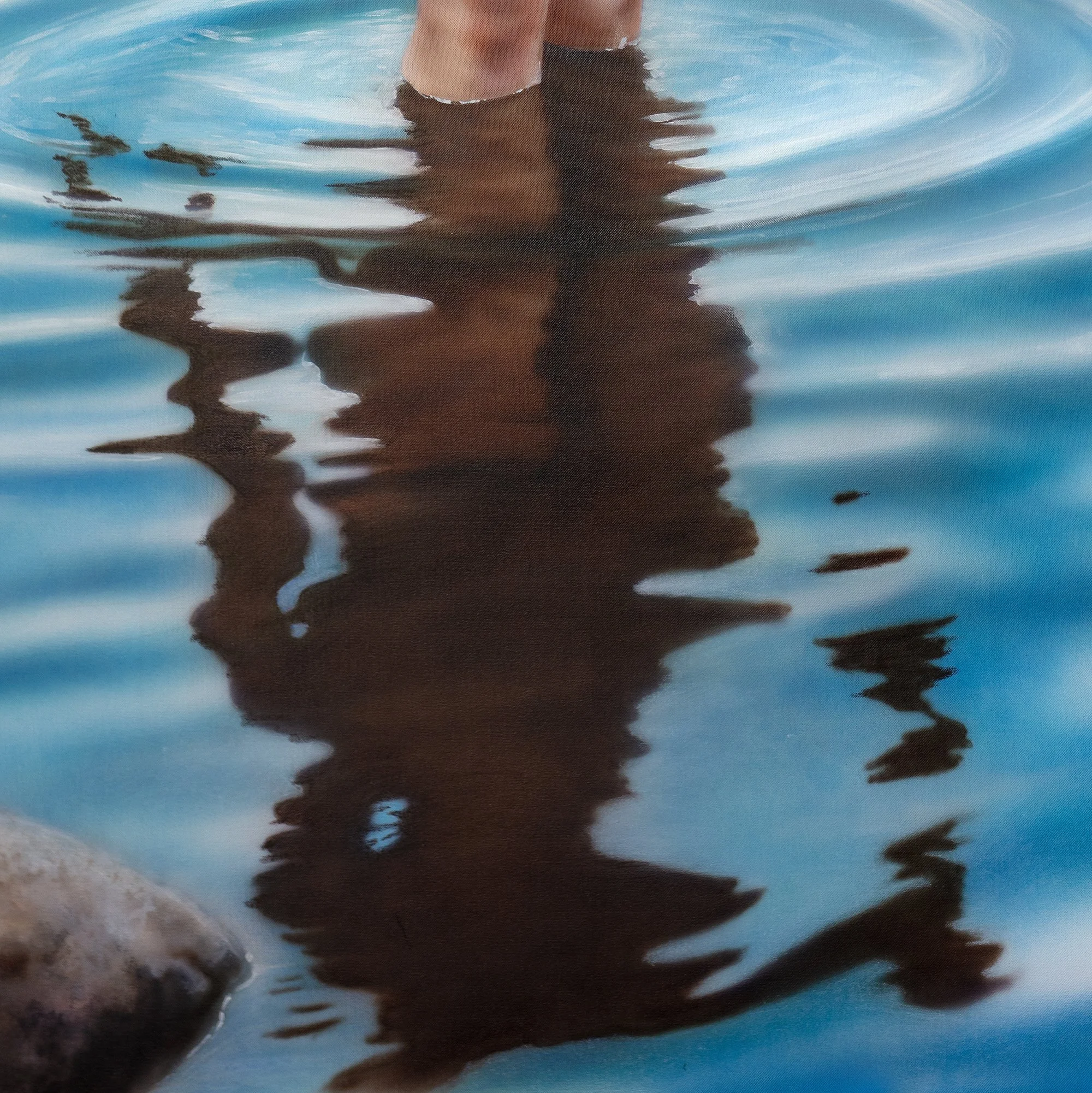 Vattenringar by Johannes Wessmark, a nude woman wading beside shoreline rocks with circular ripples and her reflection in blue water.