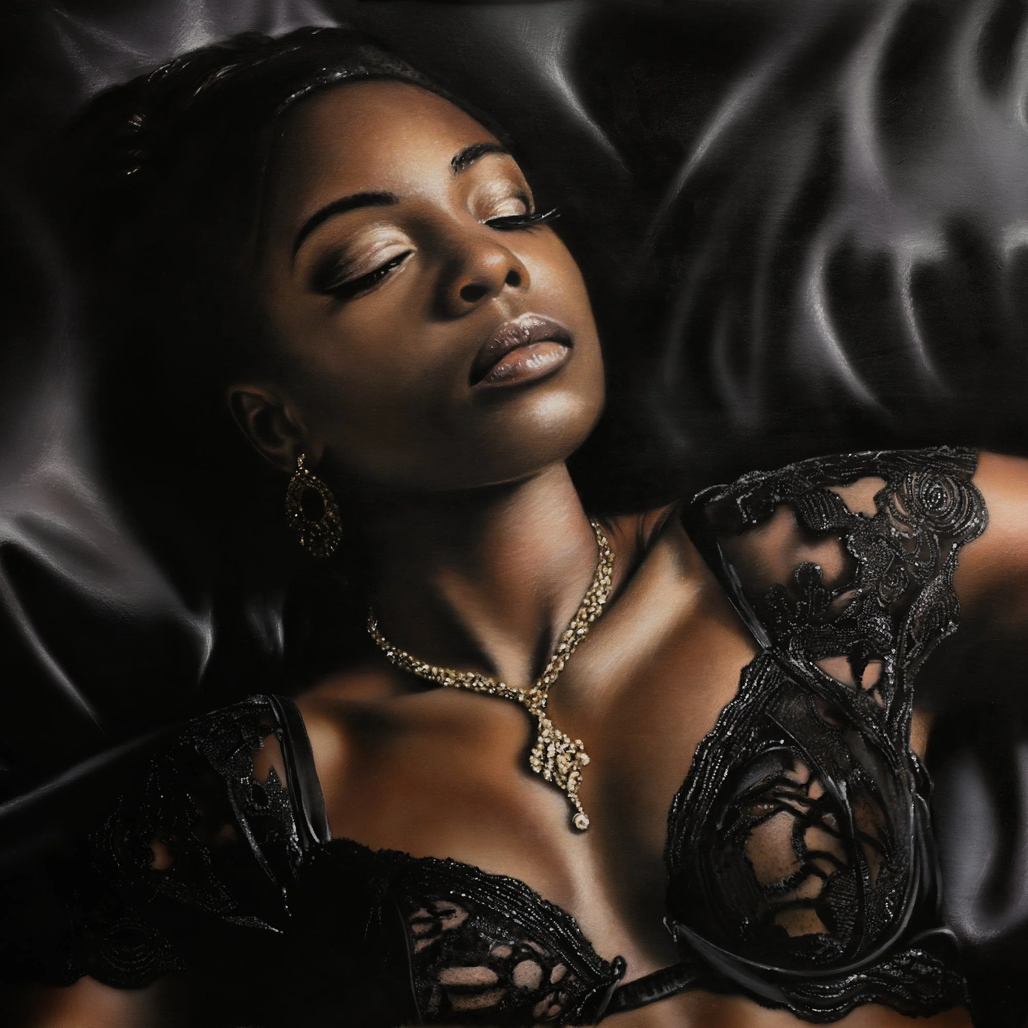 Black Beauty by Johannes Wessmark, a reclining woman in black lace lingerie and jewellery against glossy black satin.