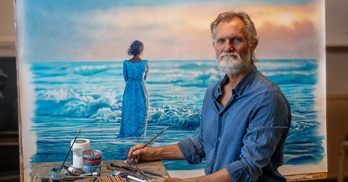 Johannes Wessmark in his studio beside a large figurative painting