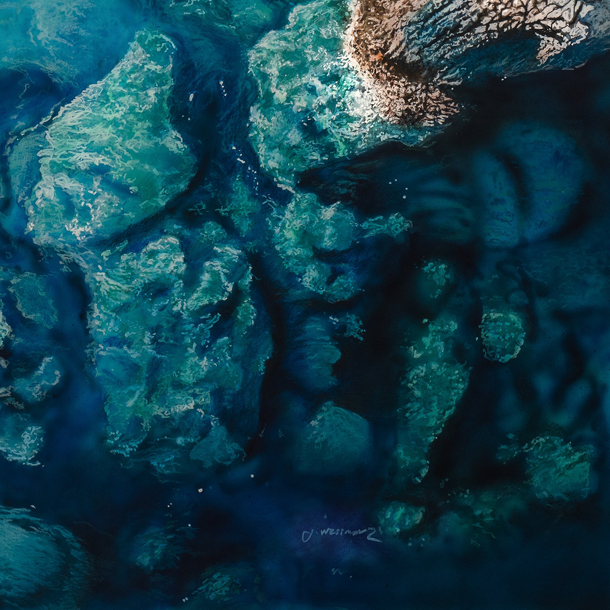 The Reef by Johannes Wessmark, an overhead view of submerged rocks in clear turquoise and deep blue water beside pale shoreline stone.