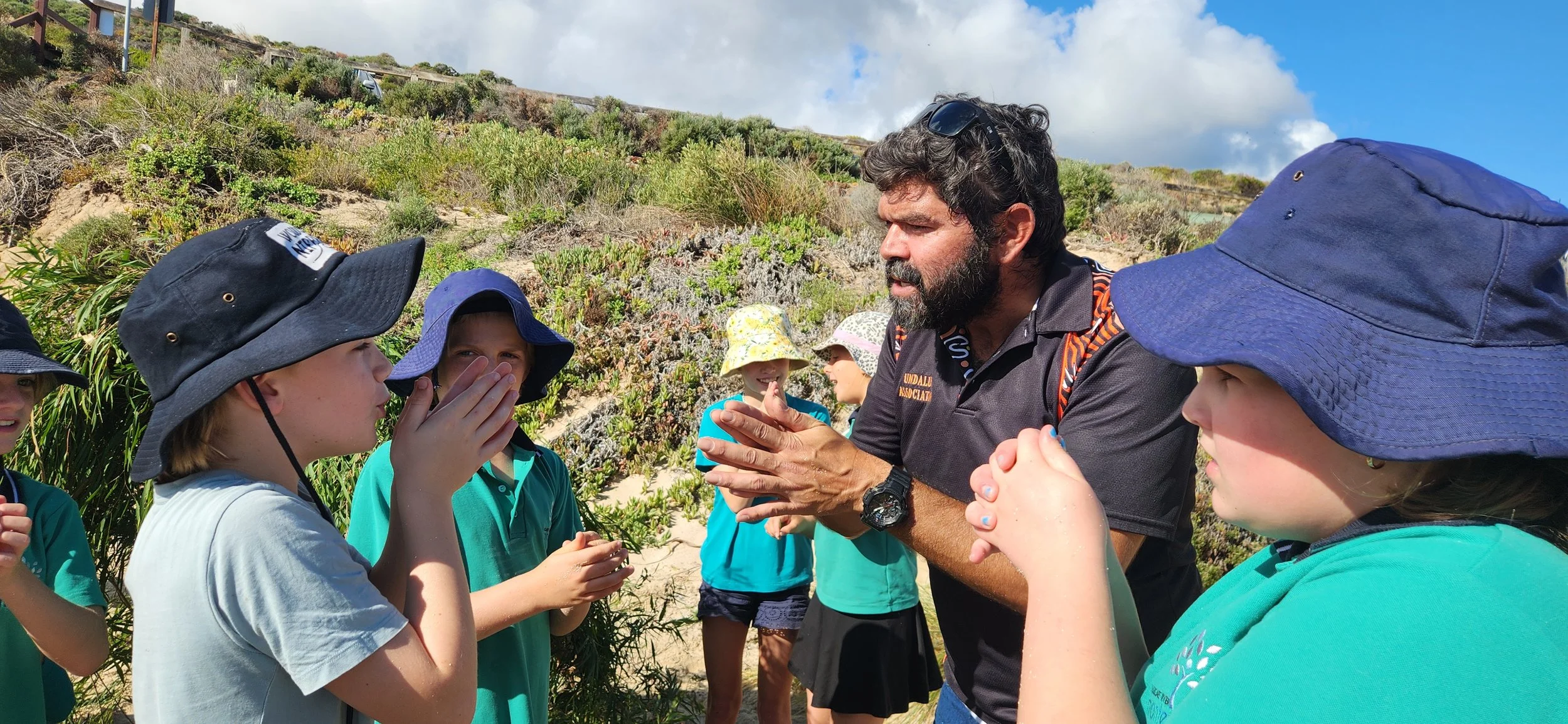 Learning how to whistle using Peppi leaves.jpg