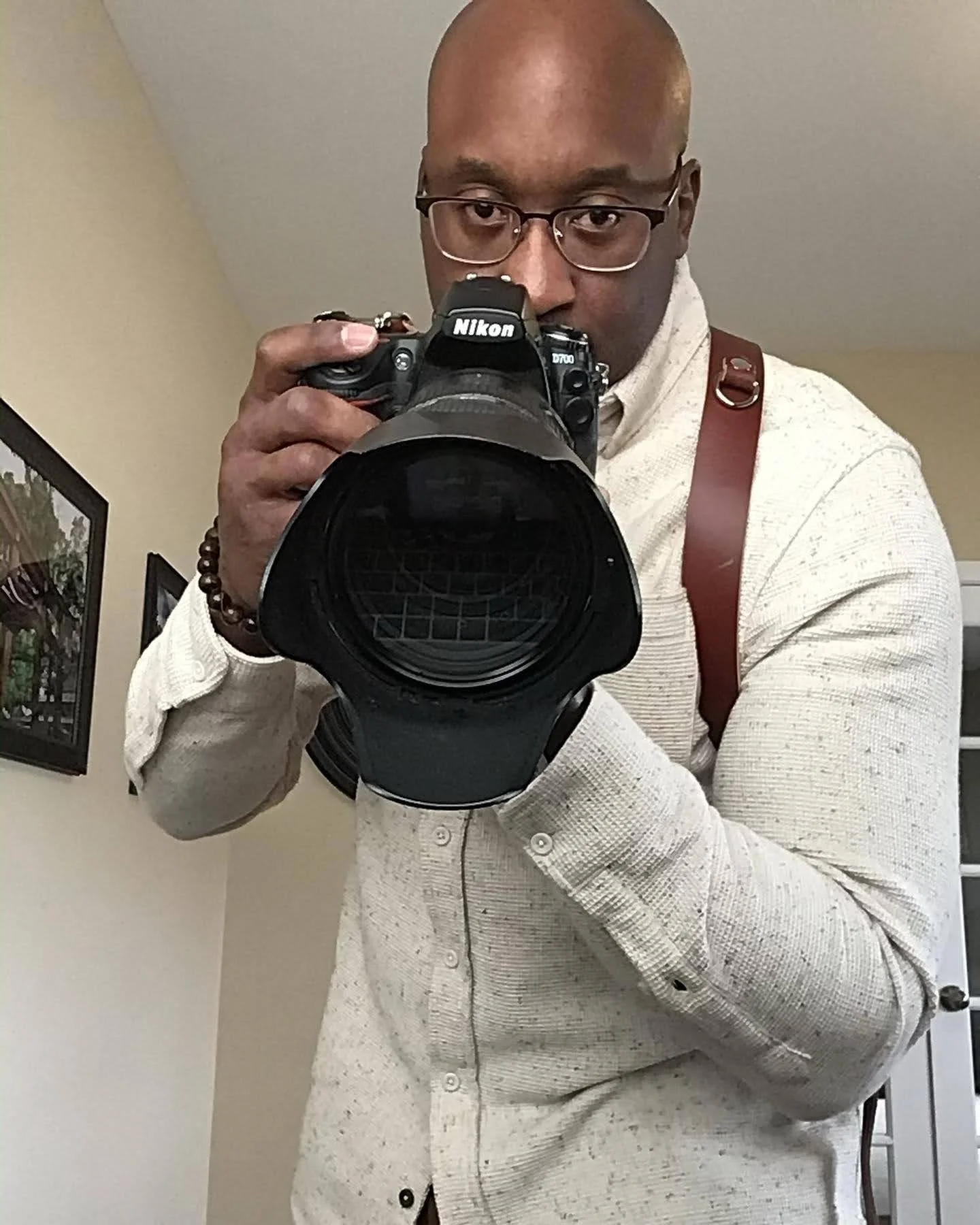 Photo of Derek Johnson holding his camera