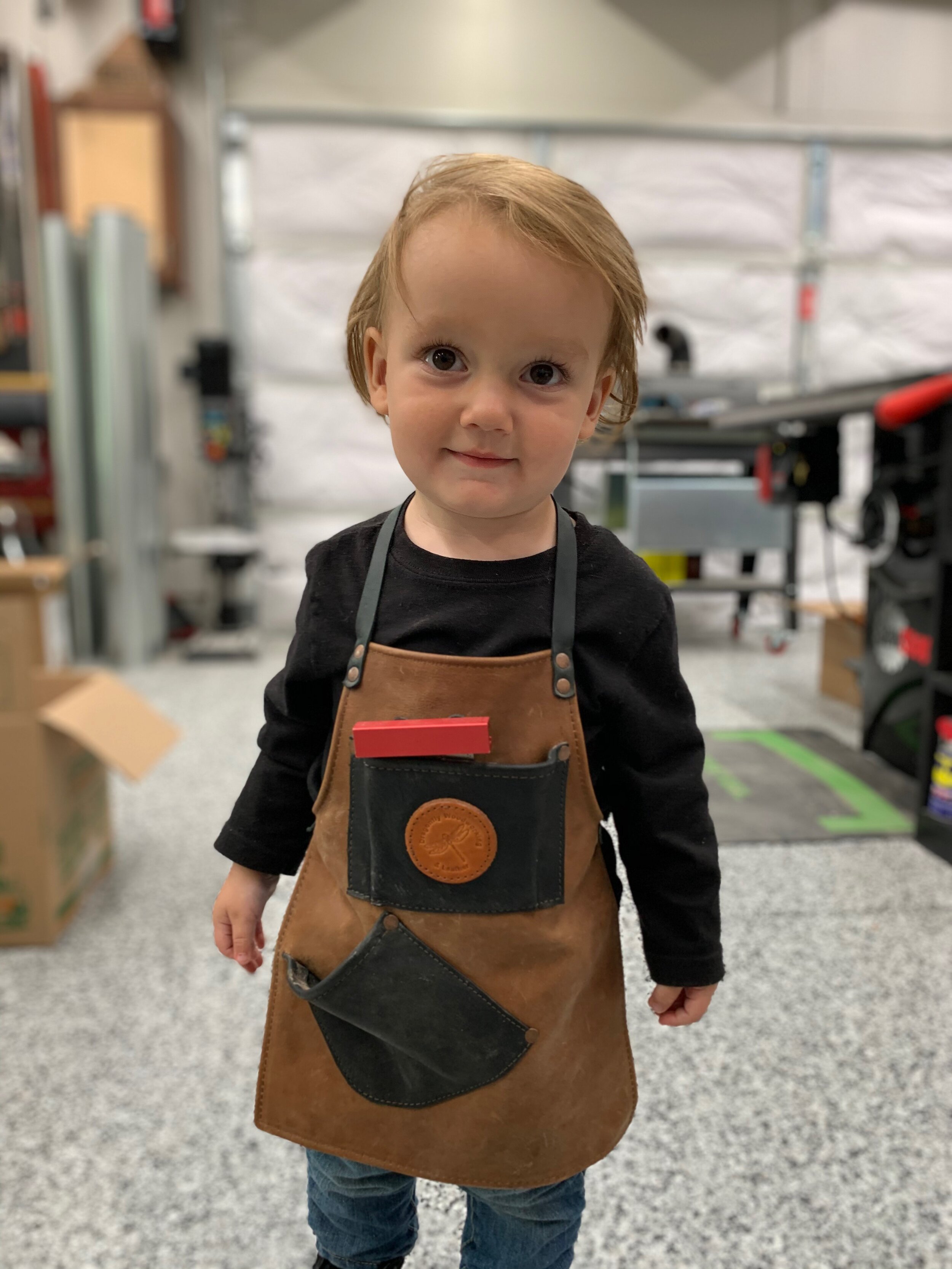 Little Leo has his own Leather By Dragonfly apron. (photo courtesy Jason Bent) 