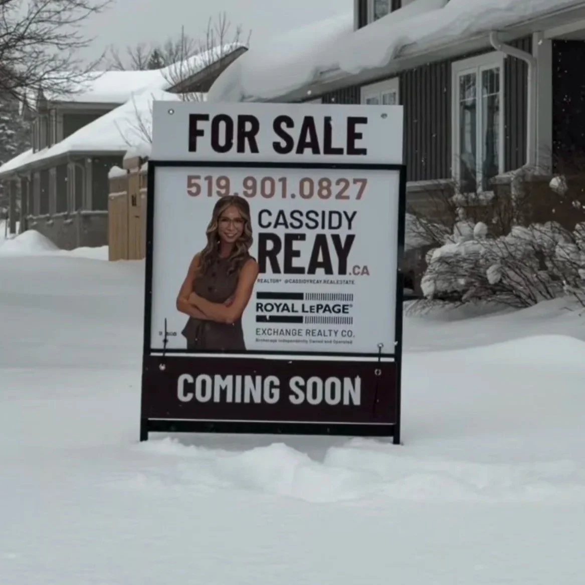 For sale sign in snow with contact information and a photo of Cassidy Reay, a real estate agent - Signupsigns - Neustadt.