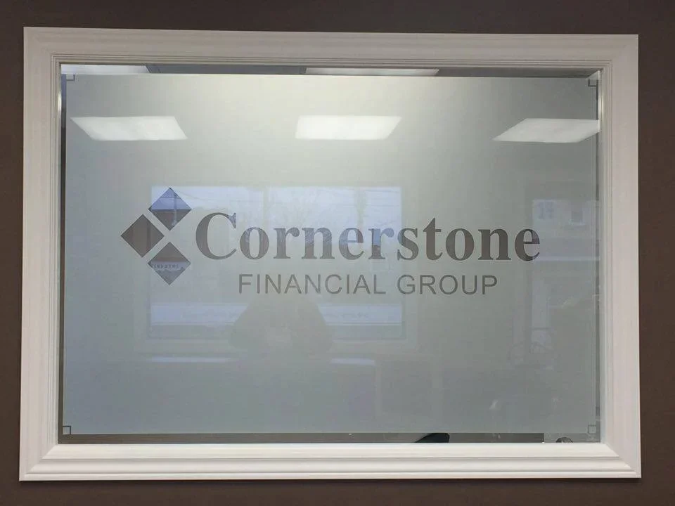 Glass window with the logo and name of Cornerstone Financial Group and the company's name underneath.