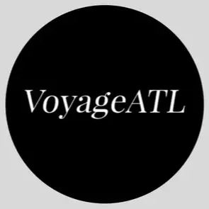 Black circle with white text that says 'VoyageATL'