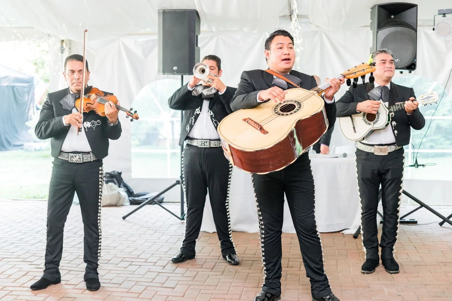 A mariachi bank performs at a summer wedding reception located at Historic Jasmine, a whimsical wedding venue in New Kent, Virginia. 