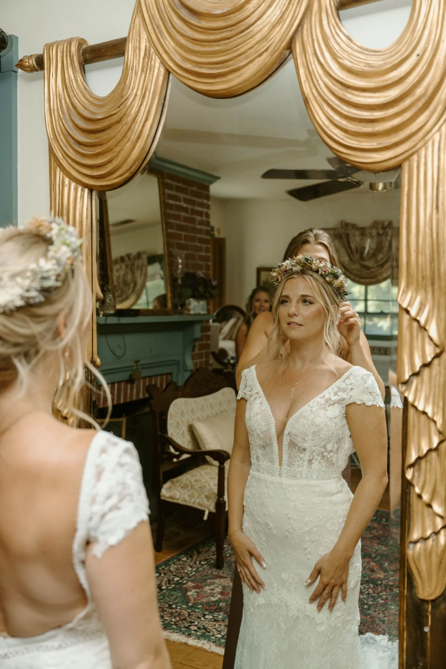 Bride wears on a Boho floral crown before her woodland fairytale wedding ceremony at Historic Jasmine, a private wedding venue in New Kent, Virginia.