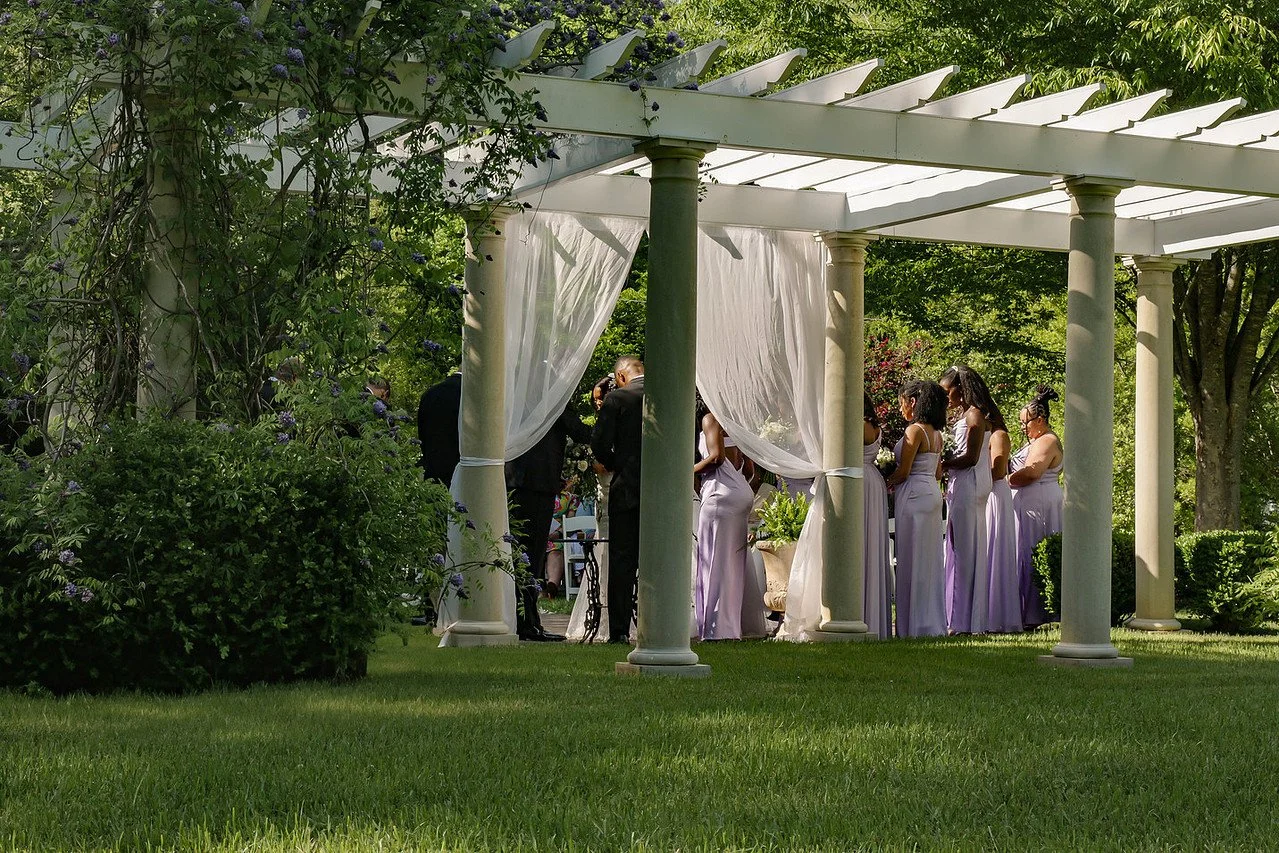 Garden Pergola ceremony site during a spring ceremony | Historic Jasmine, a private wedding venue in New Kent, Virginia.