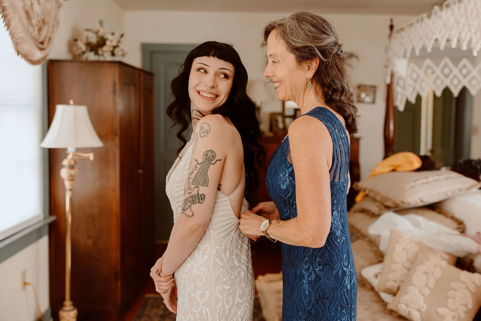 A bride and her mother's first look in the bridal suite before the wedding ceremony at Historic Jasmine, a private wedding venue in Greater Richmond, Virginia.