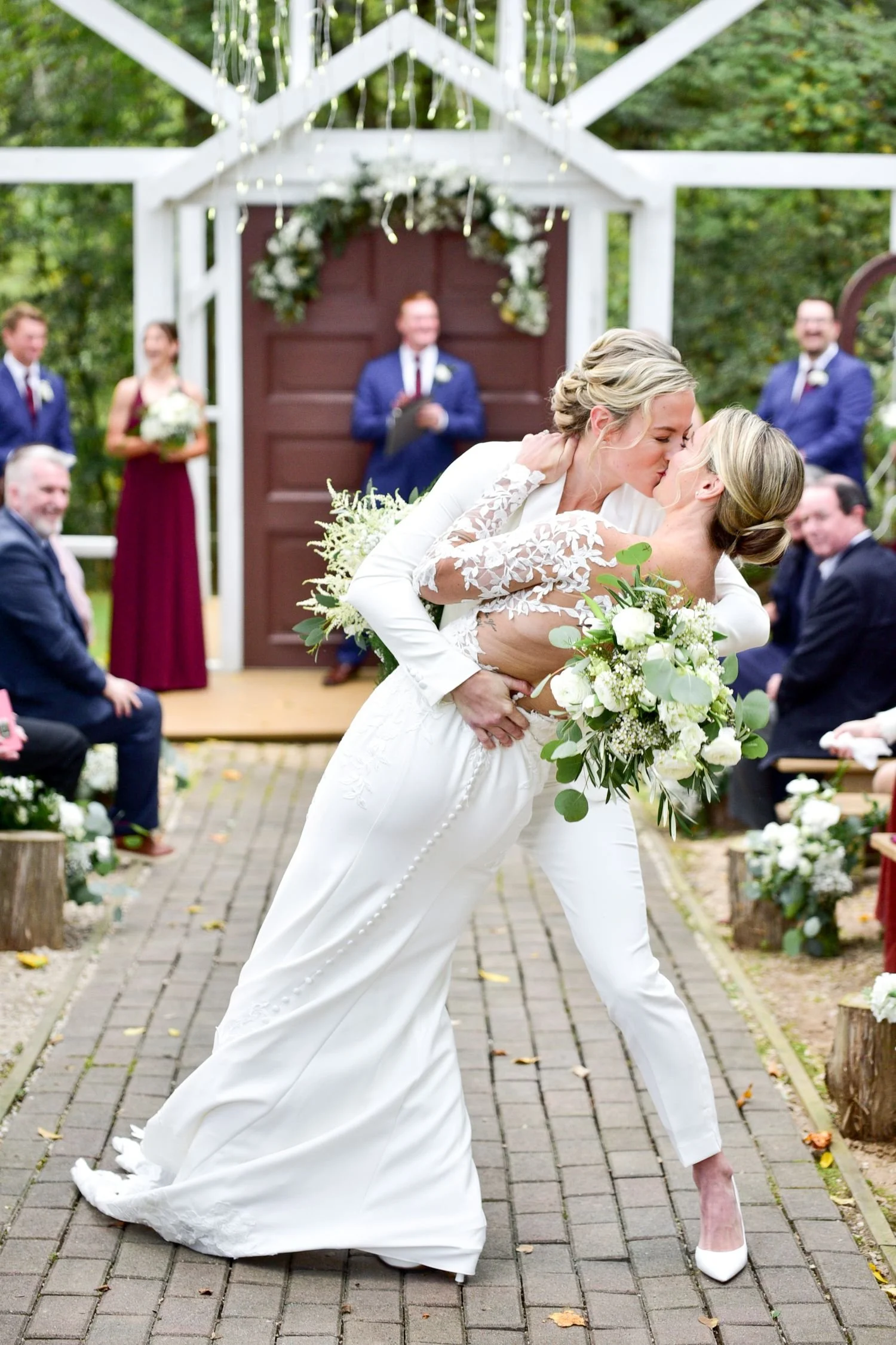 Newlywed brides kiss after the ceremony at Historic Jasmine, a LGBTQ+ friendly wedding venue in New Kent, Virginia.
