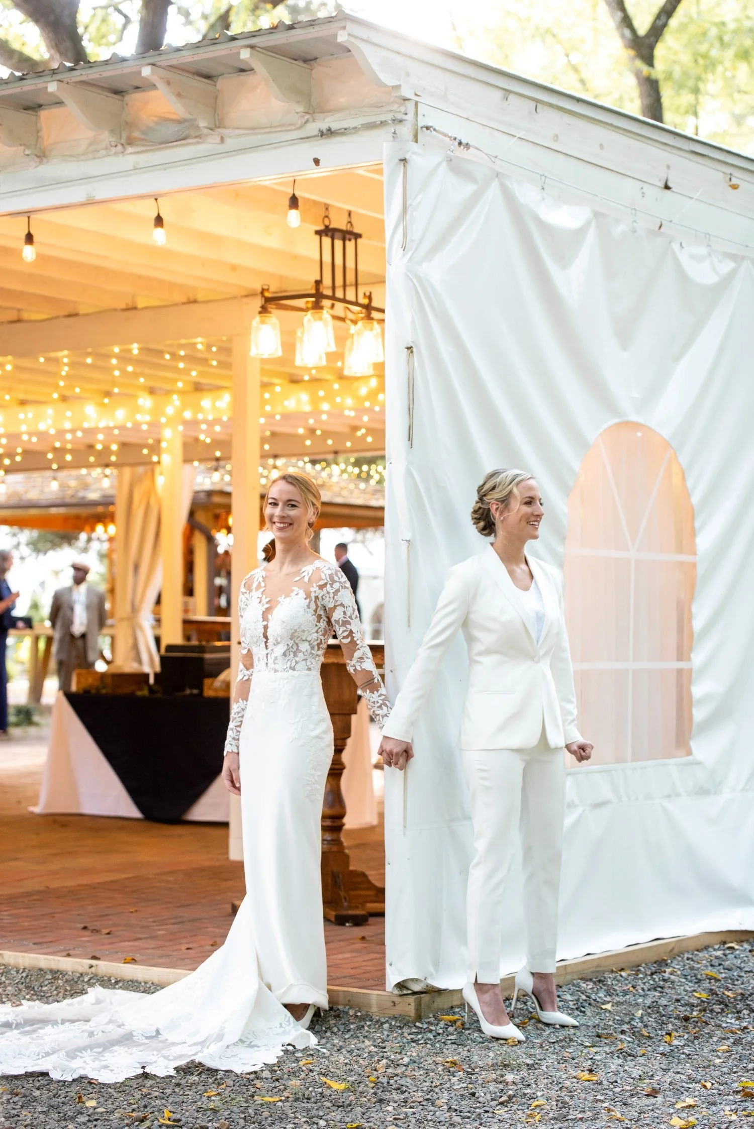Two brides pose for their "first touch" portrait at Historic Jasmine, voted a Best LGBTQ+ Friendly wedding venue near Richmond, VA