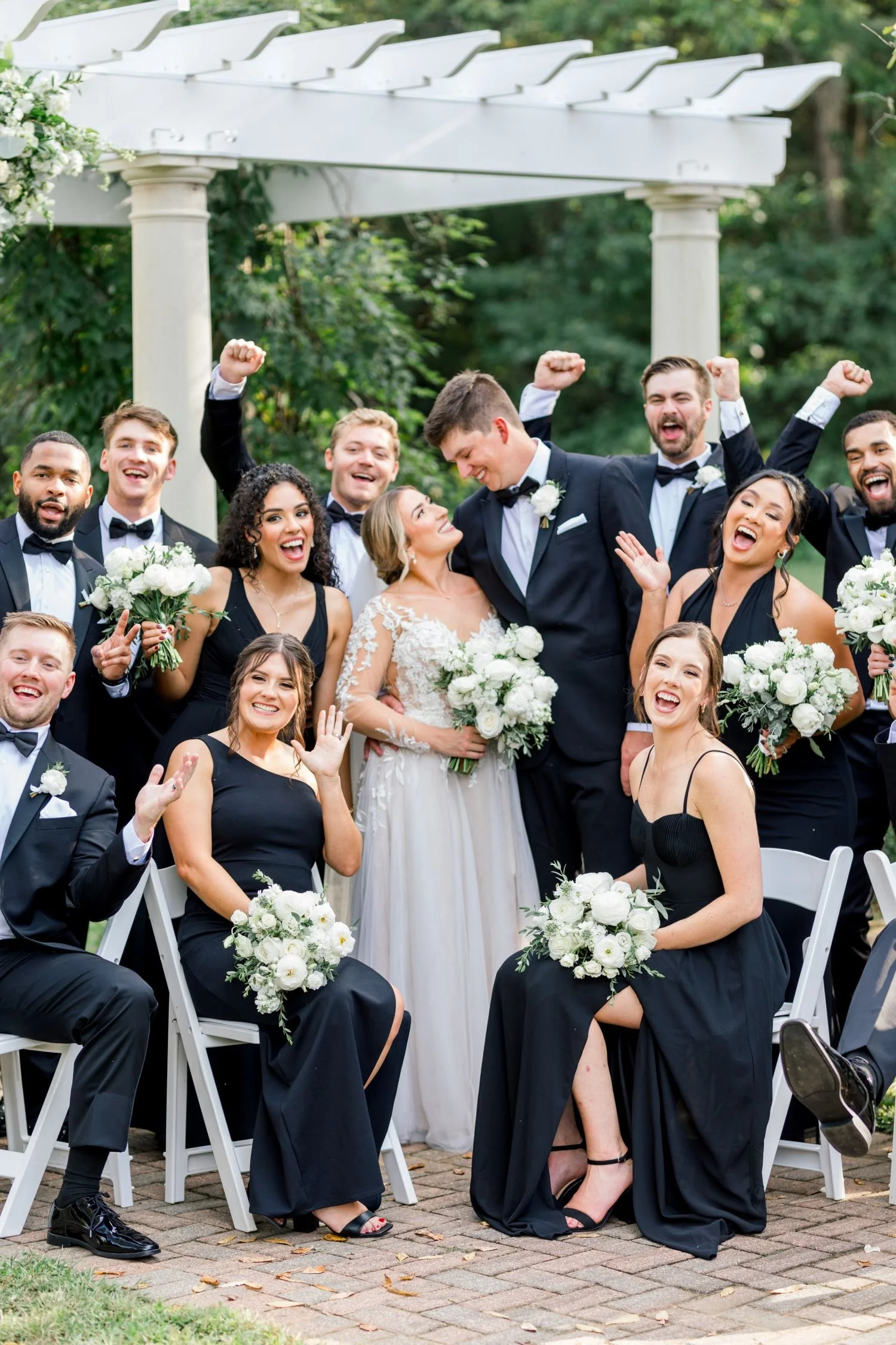 A candid portrait of the bridal party after a garden ceremony hosted at Historic Jasmine, a beautiful wedding venue near Richmond, VA.