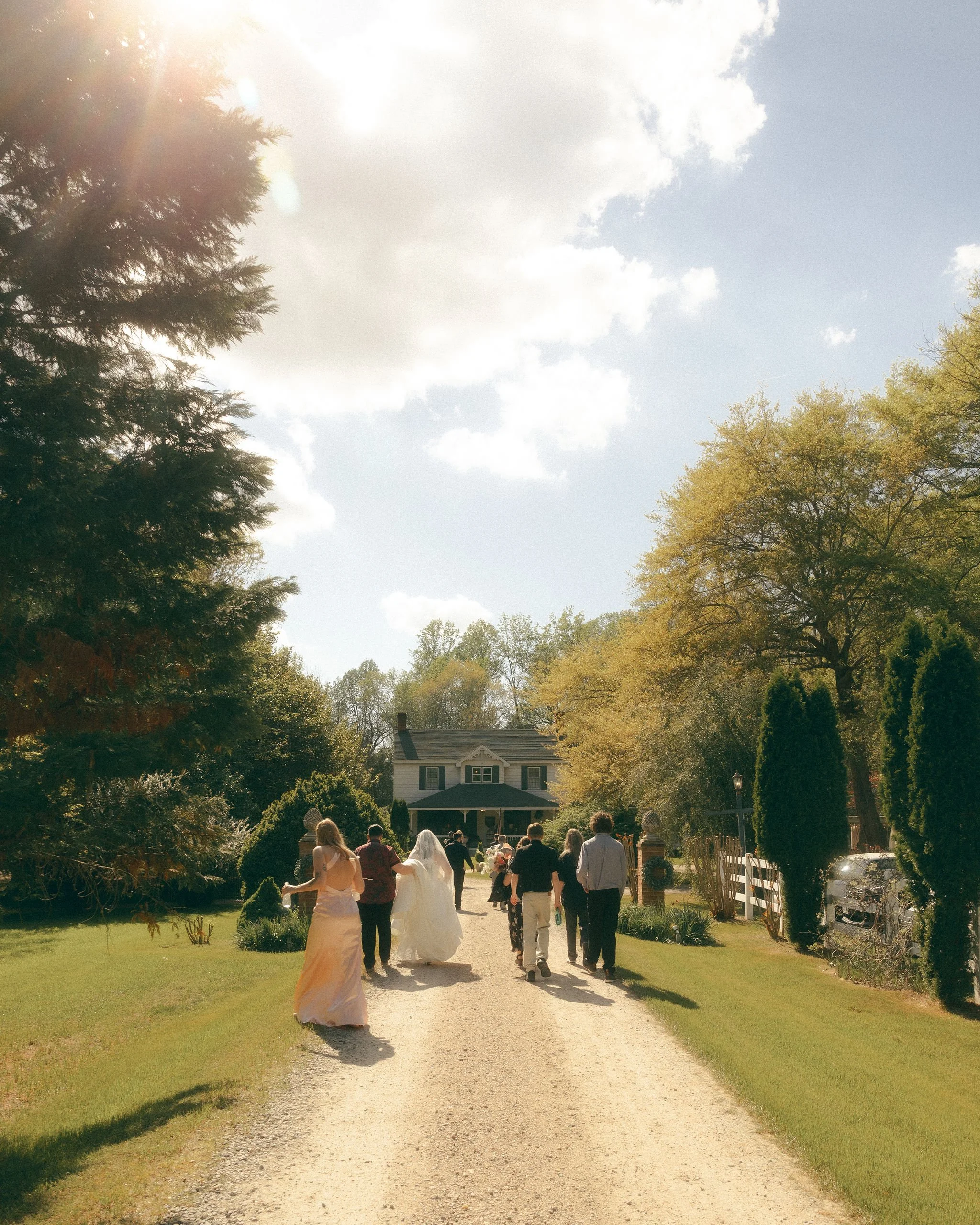 Wedding party walking up to Historic Jasmine near Williamsburg