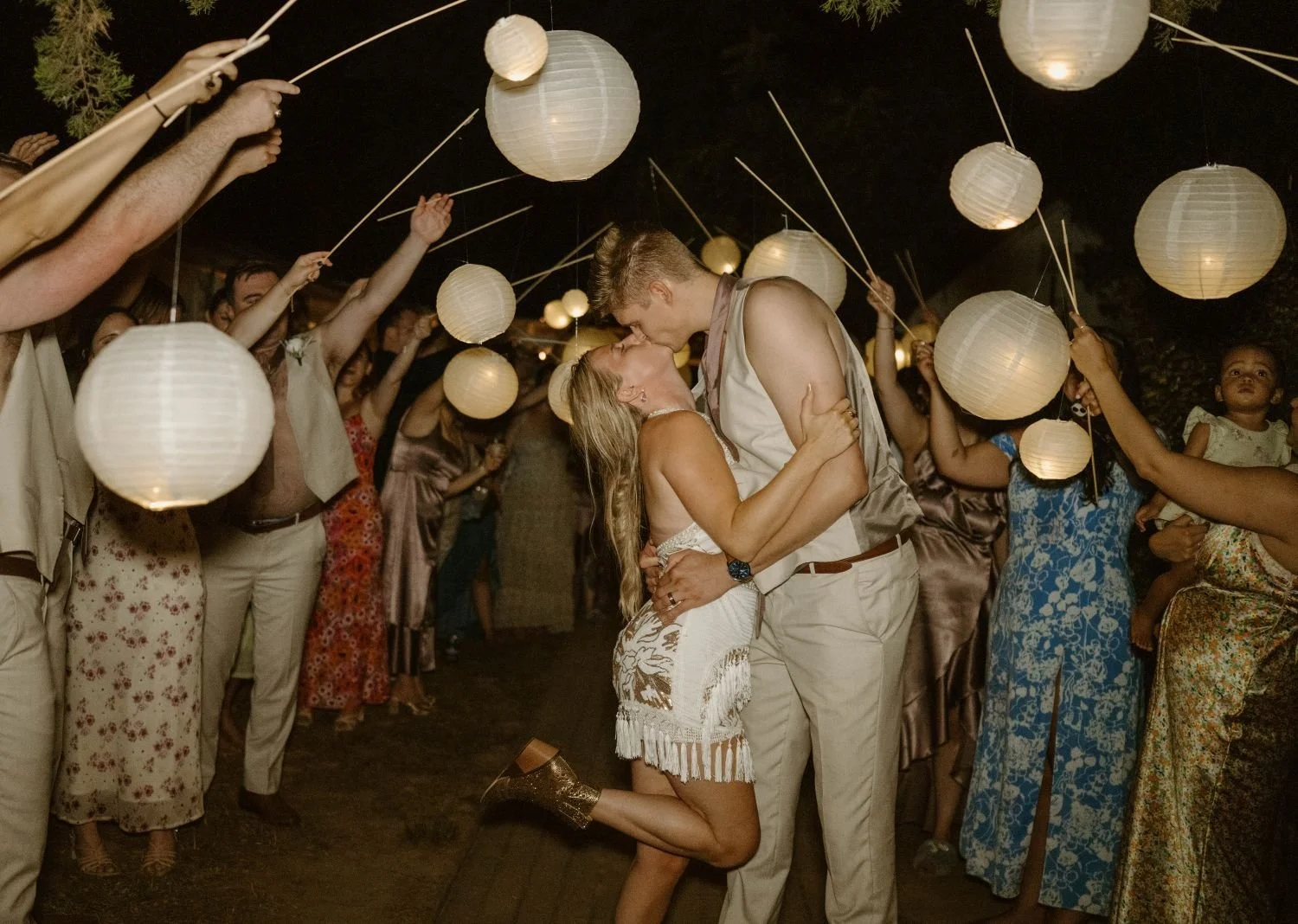 A bride and groom's romantic kiss during a wedding send-off hosted at Historic Jasmine, a private event venue near Richmond, VA. 
