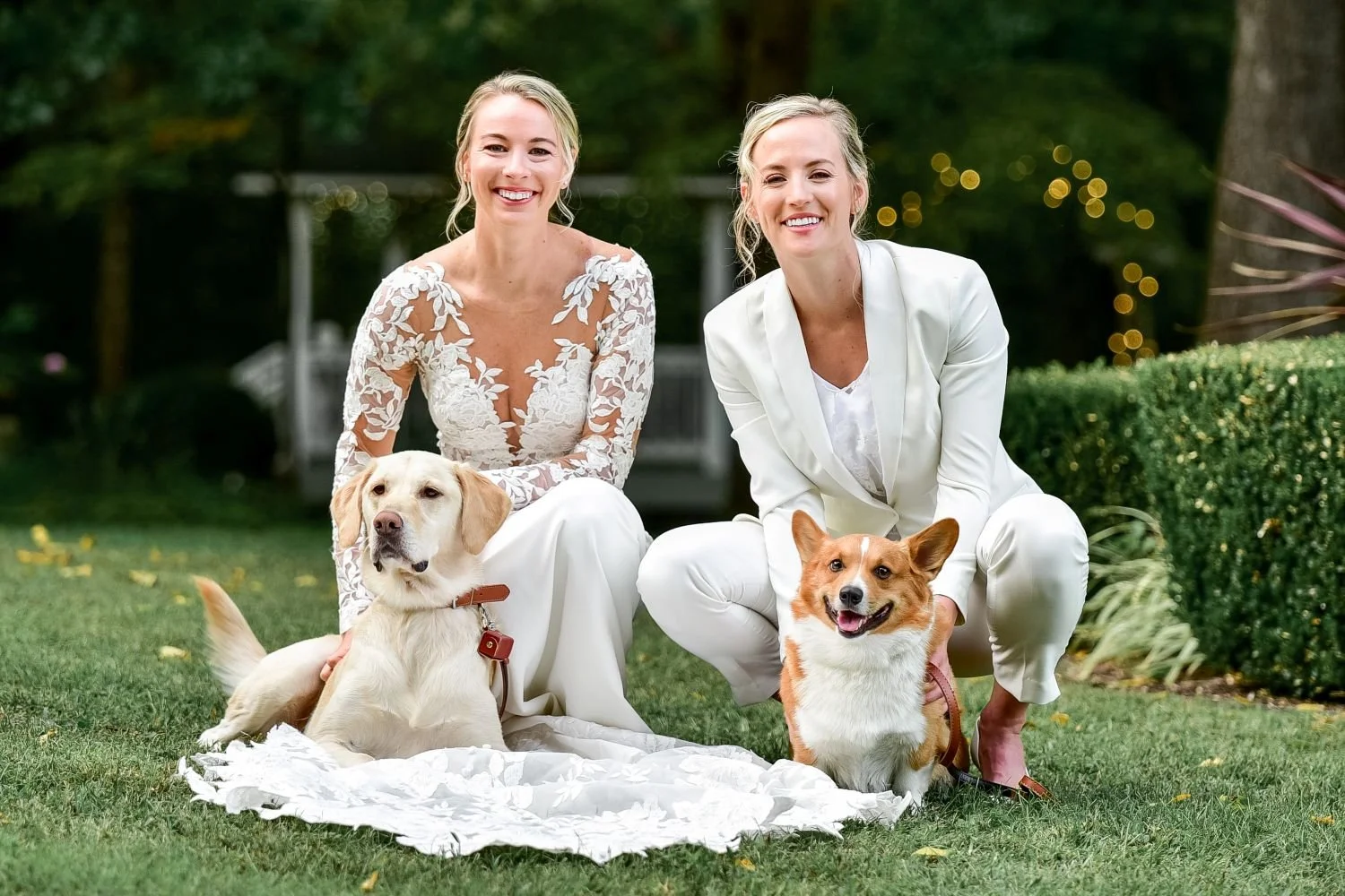 Two brides pose with their fur babies at Historic Jasmine, a pet-friendly wedding venue located in New Kent Virginia.