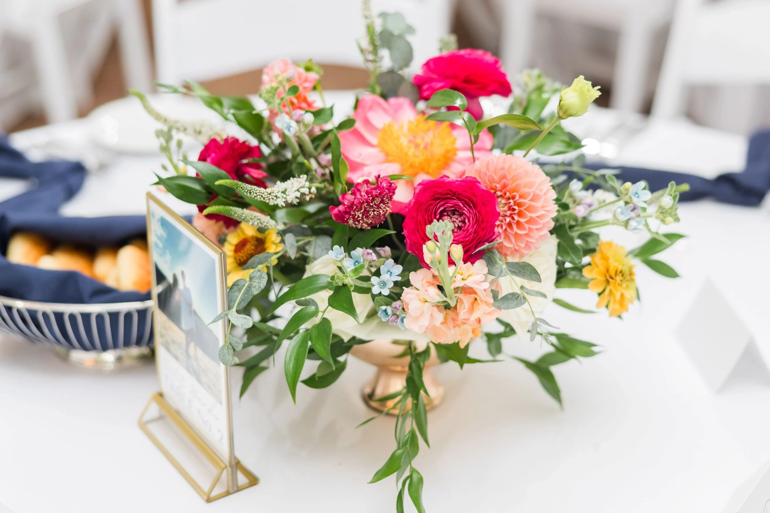 Floral centerpiece arrangement for a romantic garden wedding hosted at Historic Jasmine, located near Richmond, VA.