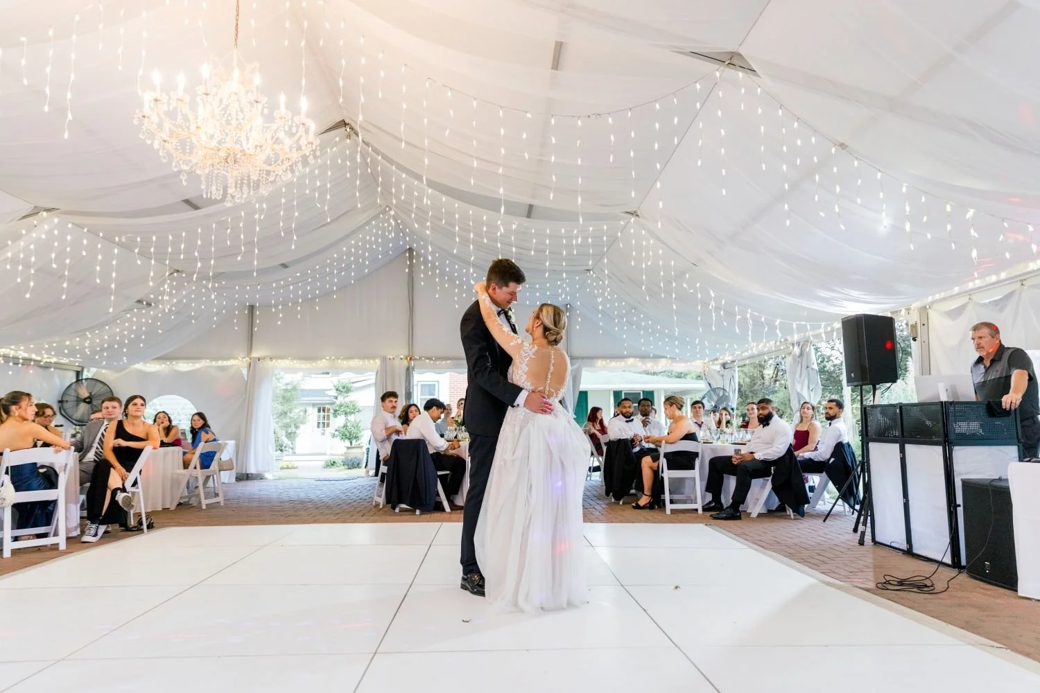 The first dance of a newlywed couple at their garden wedding hosted at Historic Jasmine, located near Richmond, Virginia.