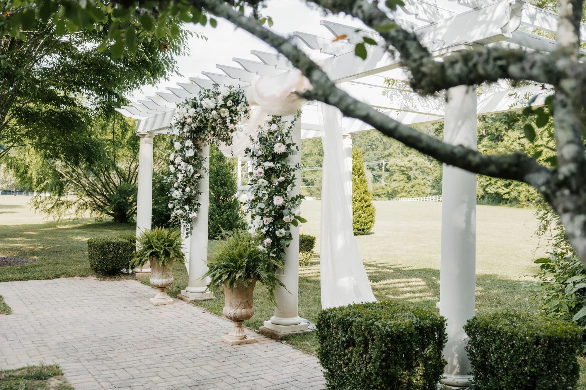 Garden pergola decorated with wedding flowers in VA
