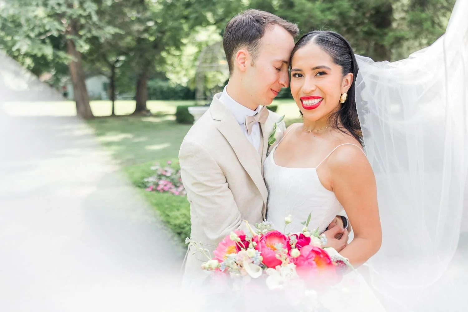 A wedding couple embraces for a portrait at a reception hosted at Historic Jasmine, an elegant wedding venue near Richmond, VA.