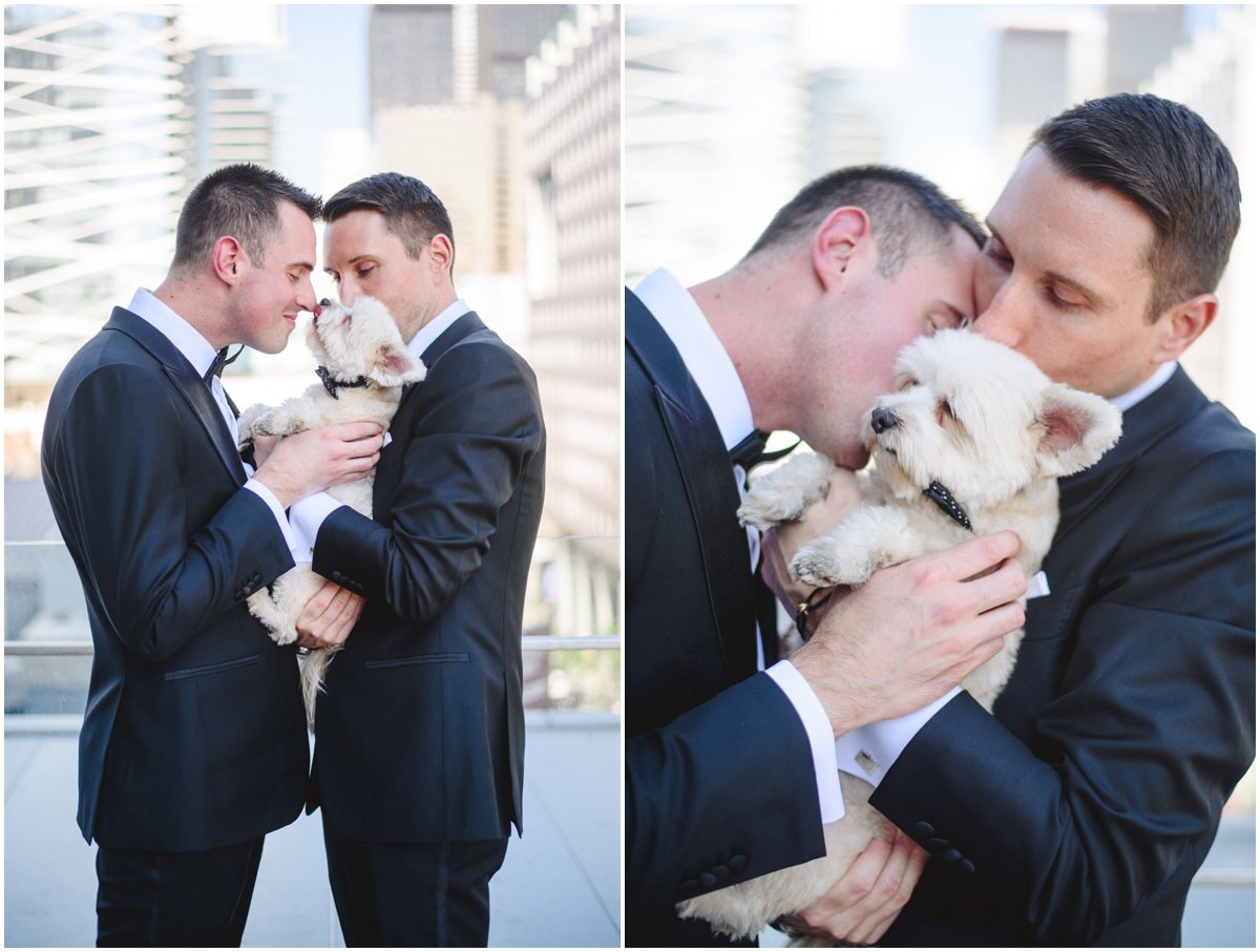 LGBTQ Couple kissing their puppy at their Malaparte wedding