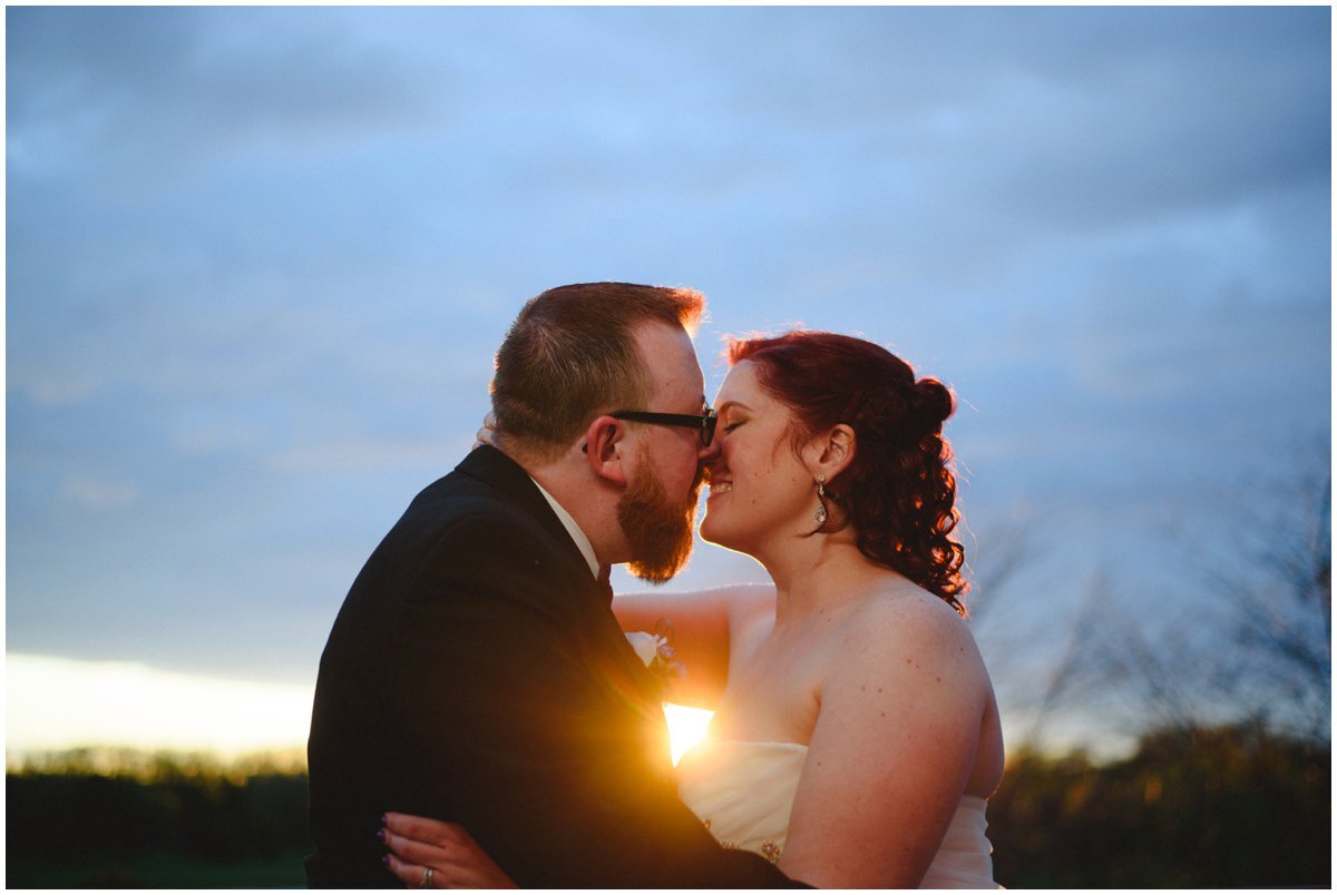 Couple kissing at sunset at Cardinal Golf Club Wedding