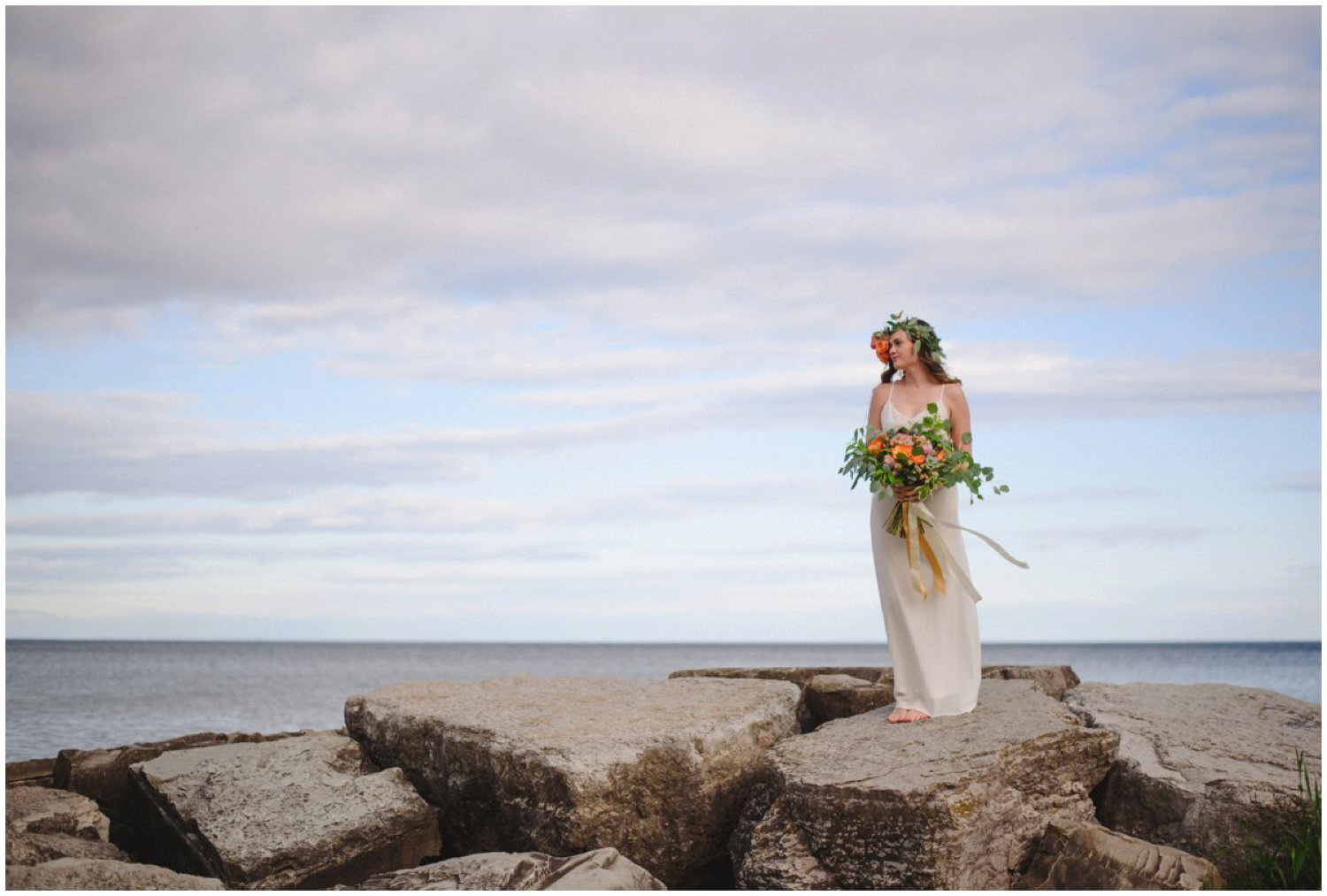 Bride with orange flower crown on the beach Toronto and Oshawa wedding photographer