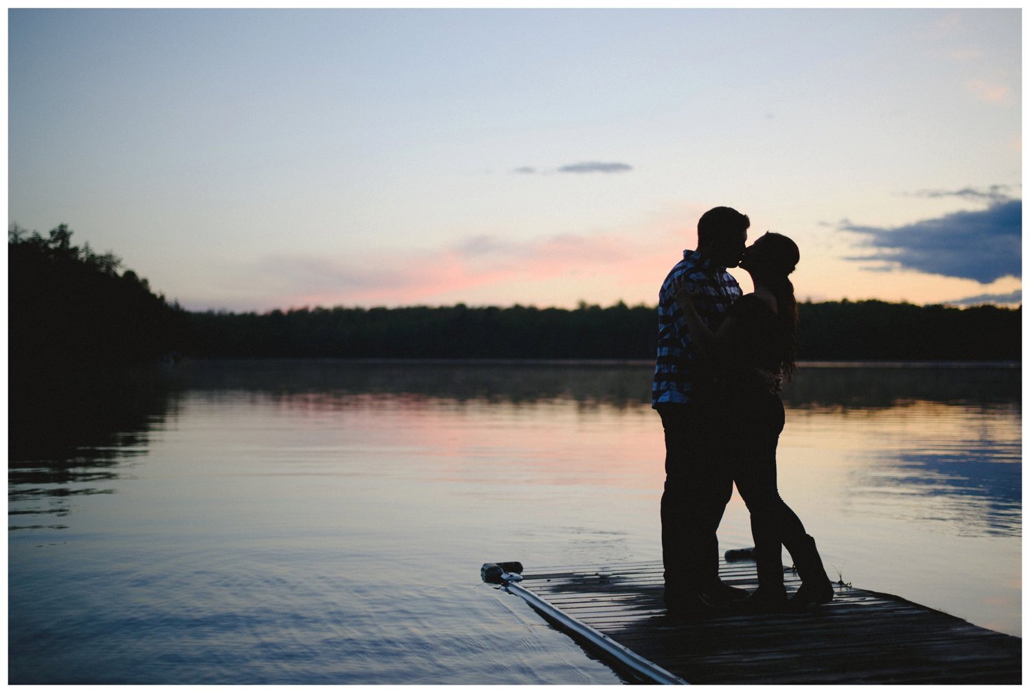 couple kissing at sunset Muskoka engagement
