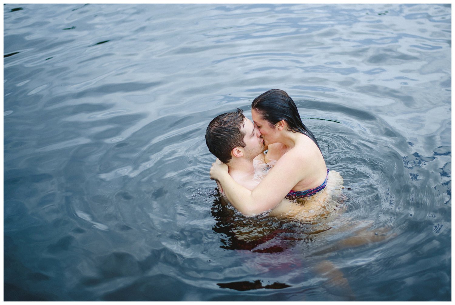 couple kissing in the water Muskoka engagement