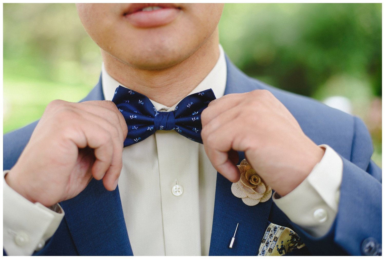 groom fixing bow tie at Doctor's House Wedding