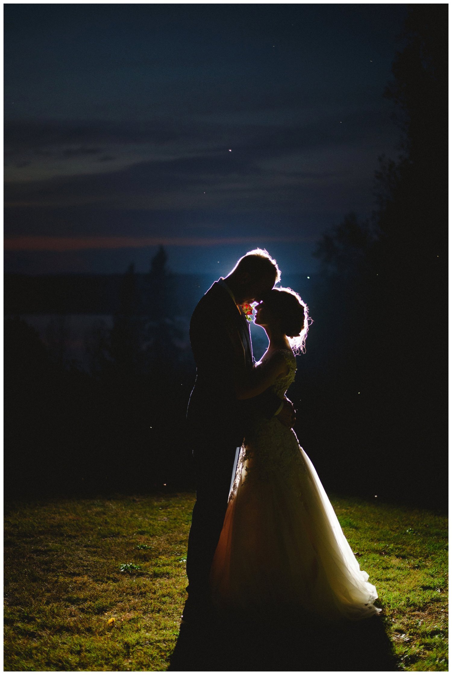 Couple kissing in the moonlight at Portage Inn Wedding in Muskoka