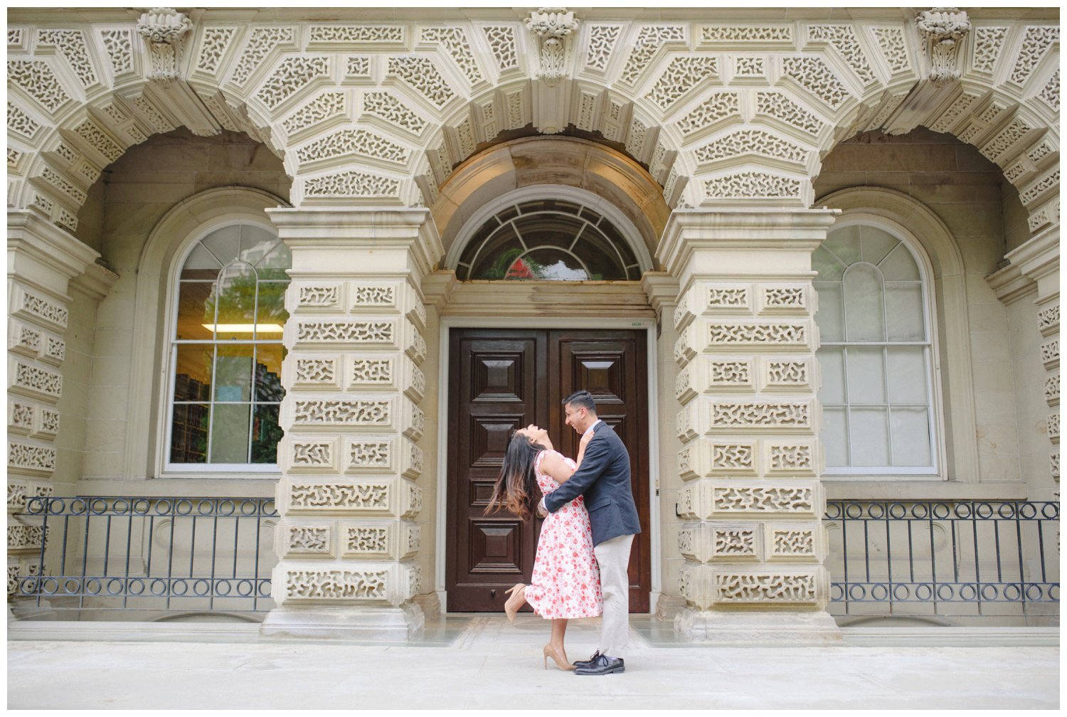 couple kissing on the steps at Osgoode Hall for their engagement photography