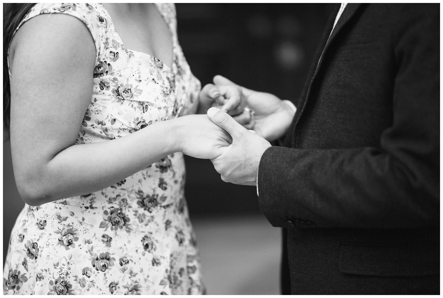 couple holding hands at Osgoode Hall for their engagement photography