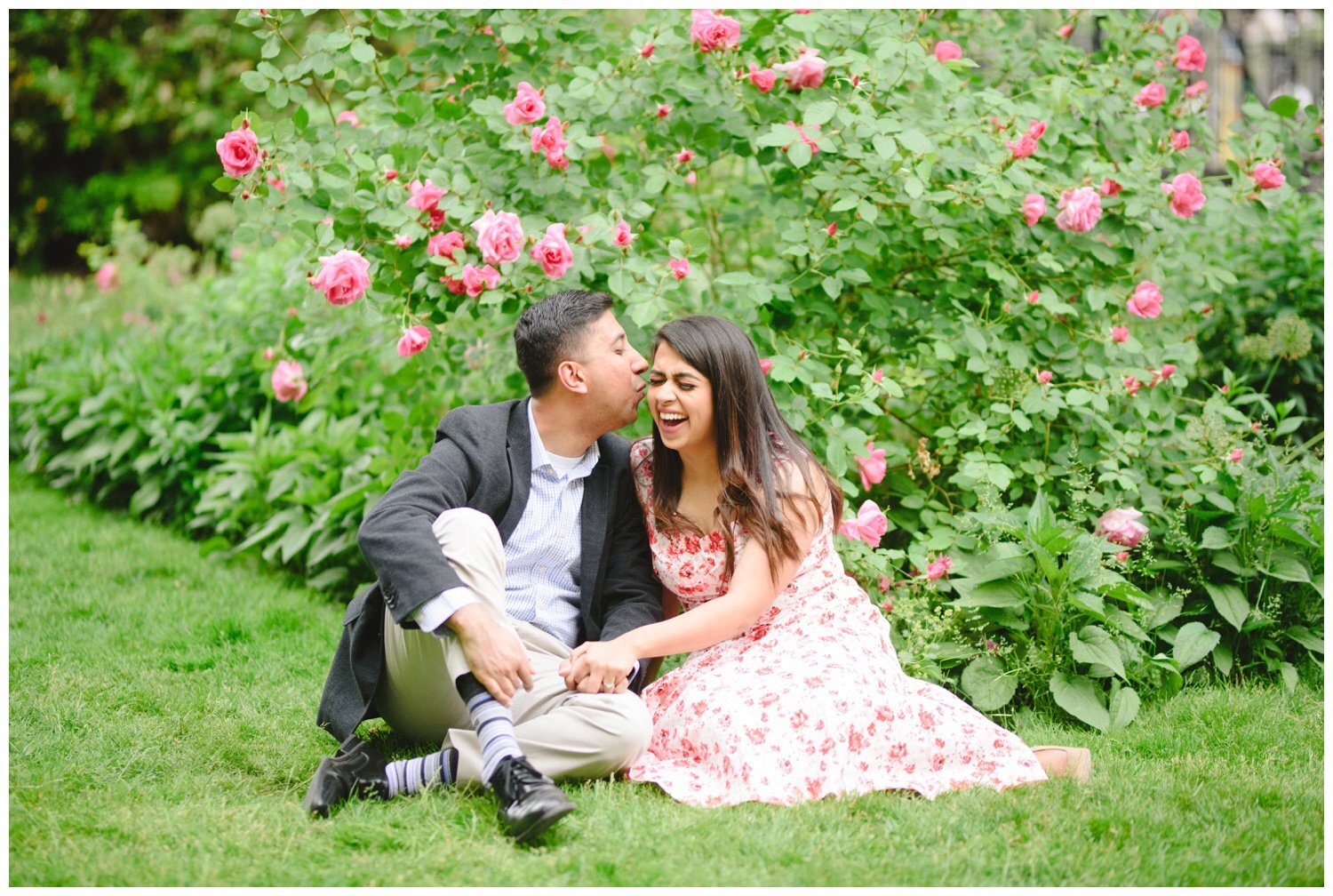 couple sitting on the grass at Osgoode Hall for their engagement photography