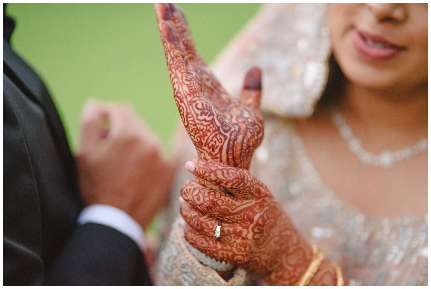 bride showing off henna at muslim wedding at Dundas Valley golf club 