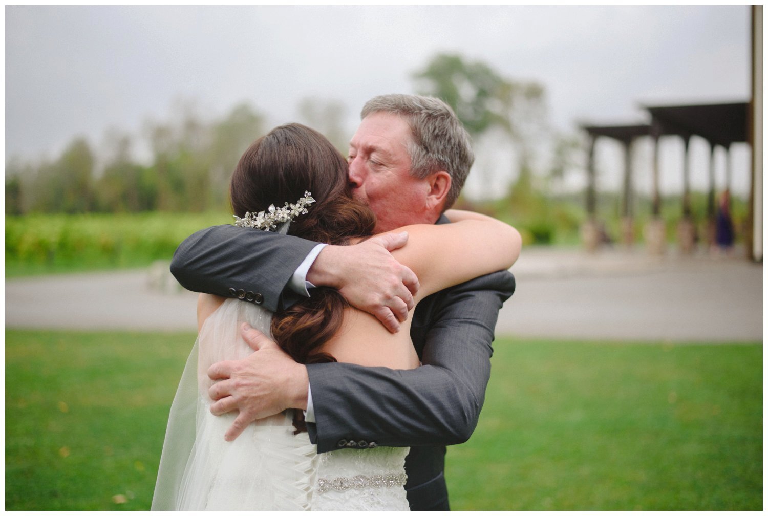 bride hugging her dad at Holland Marsh Winery Wedding in Newmarket