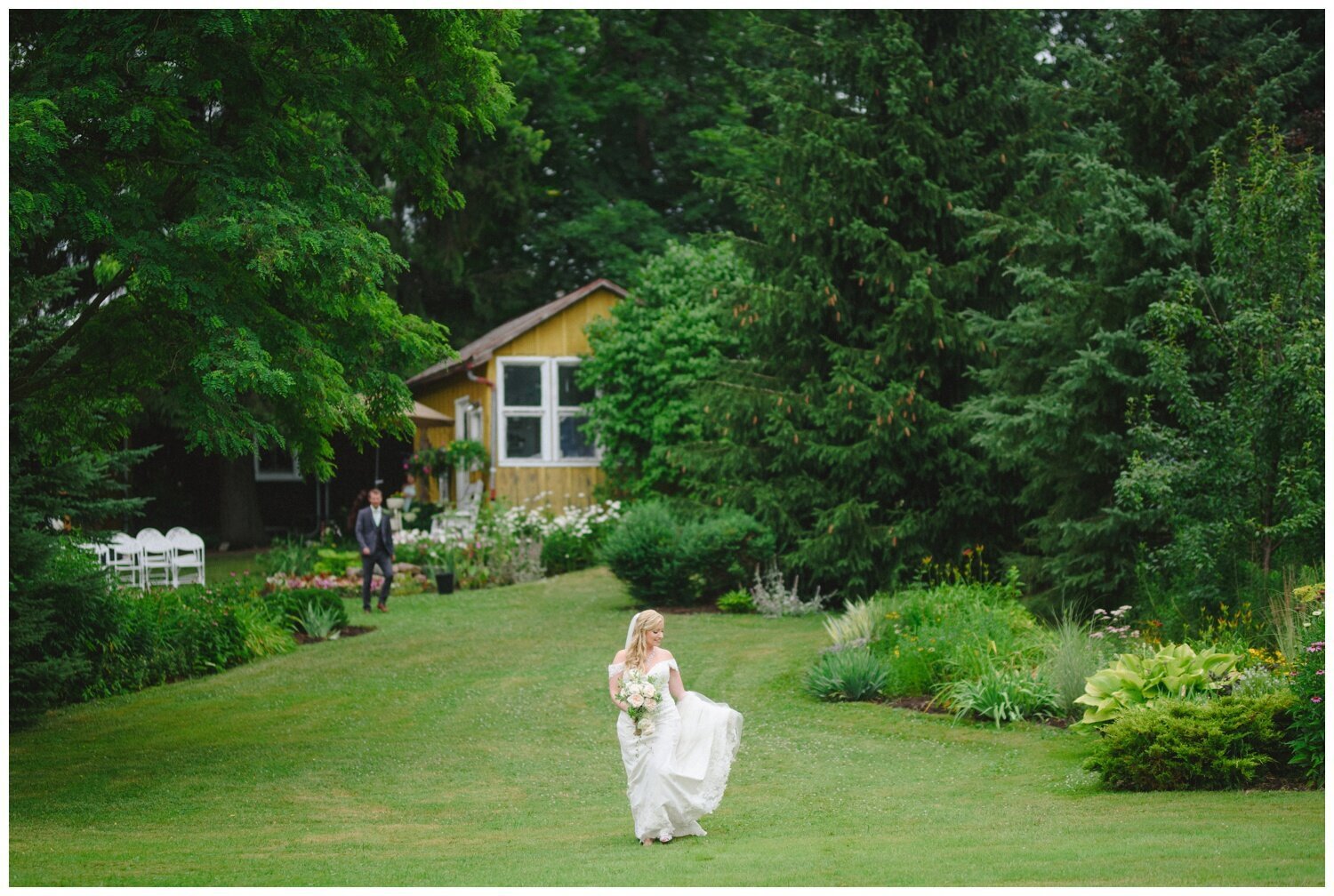 bride in the garden at backyard tent wedding in Claremont Ontario