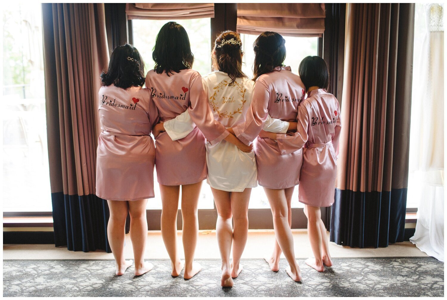 bridesmaids wearing pink silk robes at Credit Valley Golf Club Wedding