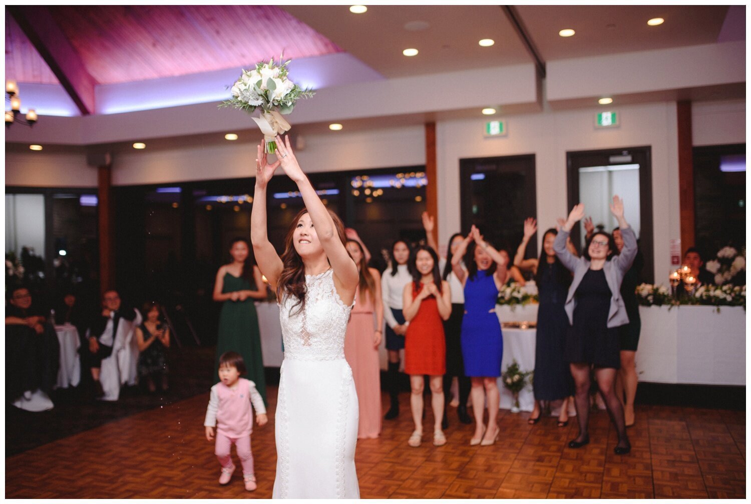 bride throwing the bouquet at Credit Valley Golf Club Wedding